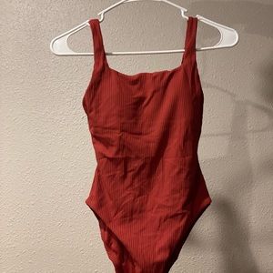 Andies one piece, xs, beautiful rich red, never worn- tags on!